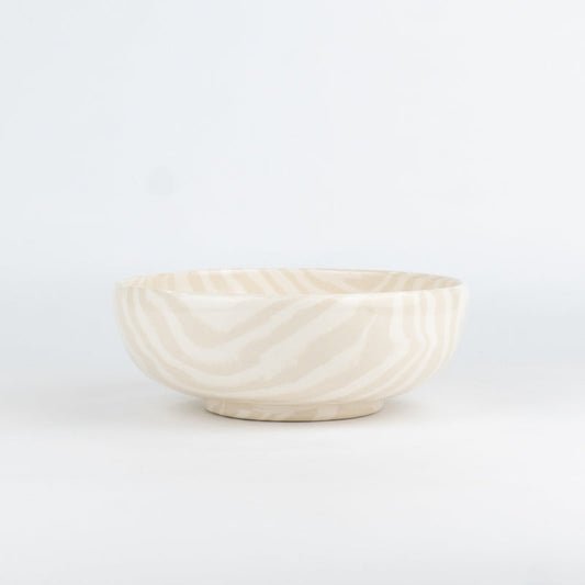 White ceramic bowl on a light gray background
